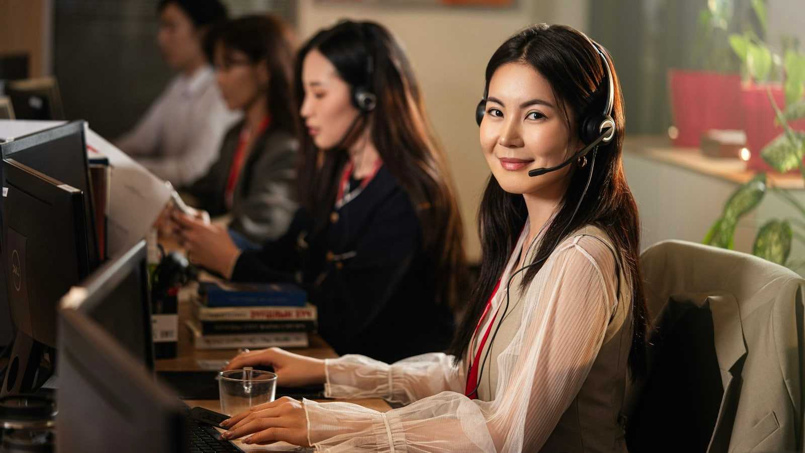 Public service professional providing support at a computer